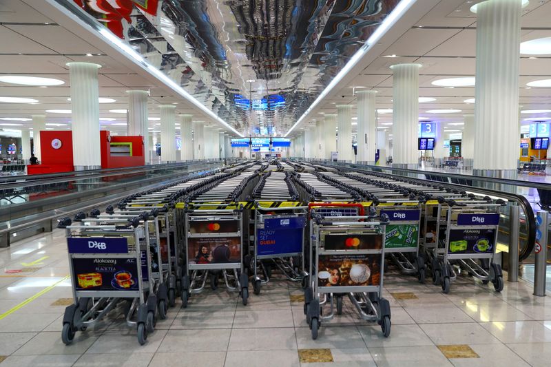 &copy; Reuters. Empty trolleys are seen at Dubai International Airport, as Emirates airline resumed limited outbound passenger flights amid the outbreak of the coronavirus disease (COVID-19) in Dubai