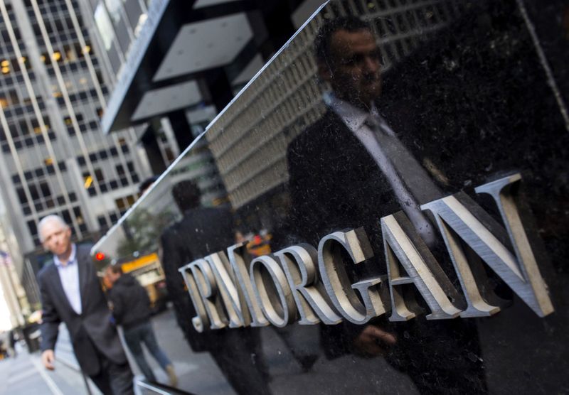 &copy; Reuters. FILE PHOTO: File photo of people walking by the JP Morgan &amp; Chase Co. building in New York