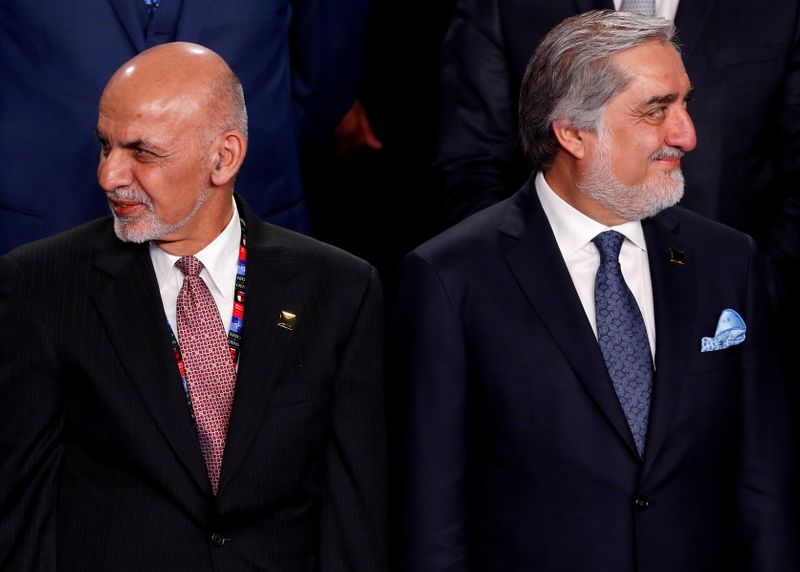 &copy; Reuters. FILE PHOTO: FILE PHOTO: Ghani and Abdullah participate in a family photo with Ghani and Abdullah at the NATO Summit in Warsaw, Poland