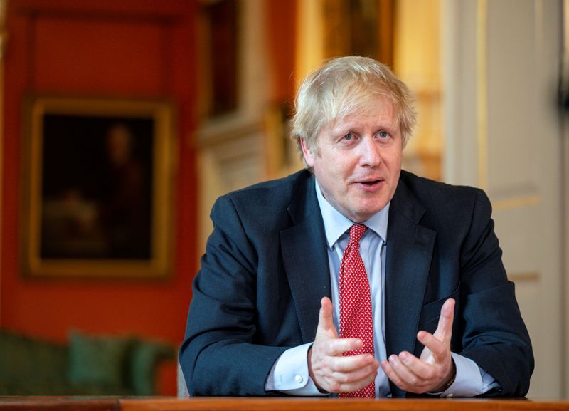 &copy; Reuters. FILE PHOTO:  Britain&apos;s PM Johnson records video message for Captain Moore&apos;s 100th birthday in London