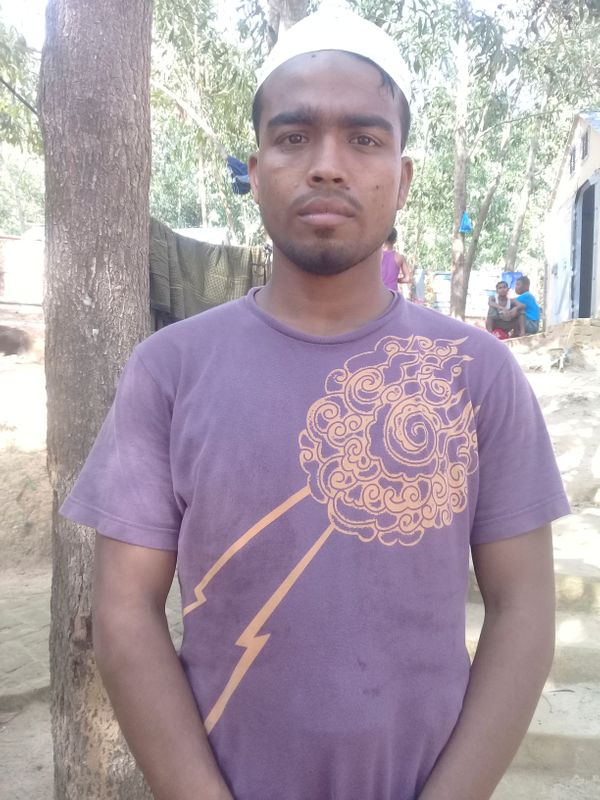 &copy; Reuters. Shahab Uddin, 20, a Rohingya refugee poses for a picture in the transit camp in southern Bangladesh after surviving two months at sea on a wooden trawler, in Cox&apos;s Bazar