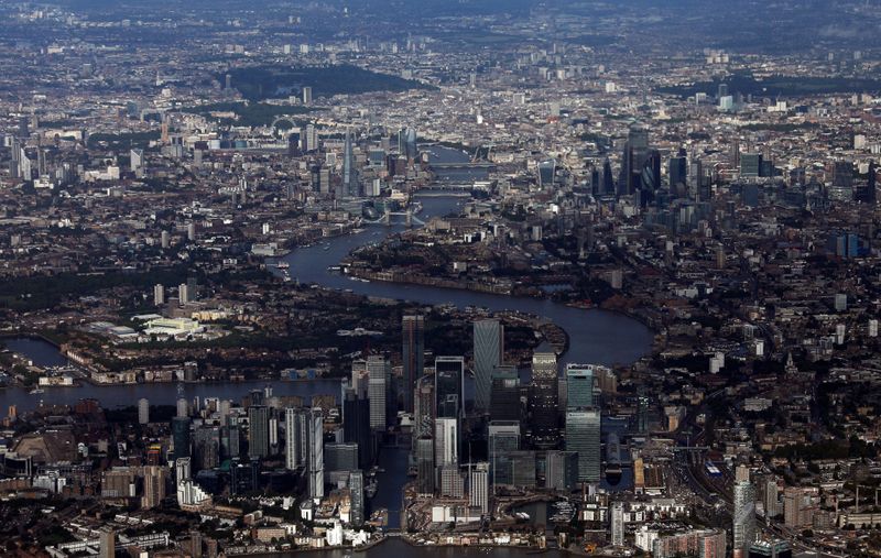 &copy; Reuters. FILE PHOTO: Canary Wharf and the City of London financial district are seen from an aerial view in London