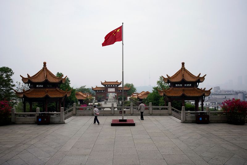 &copy; Reuters. Chinese flag flutters at the Yellow Crane Tower attraction in Wuhan