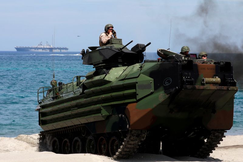 &copy; Reuters. FILE PHOTO: With the USS-Wasp in the background, U.S. Marines ride an amphibious assault vehicle during the amphibious landing exercises of the U.S.-Philippines war games promoting bilateral ties at a military camp in Zambales province