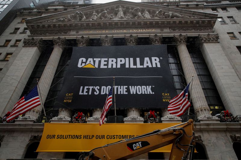 © Reuters. FILE PHOTO: A banner for Caterpillar Inc. hangs on the facade of at the NYSE in New York