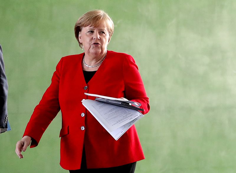 &copy; Reuters. German Chancellor Merkel speaks on COVID-19 measures after meeting regional leaders