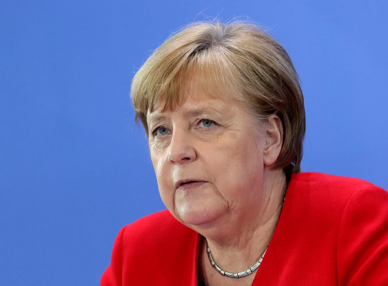 © Reuters. FILE PHOTO: German Chancellor Merkel speaks on COVID-19 measures after meeting regional leaders