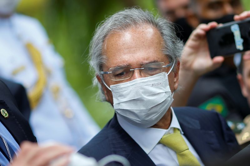 &copy; Reuters. FILE PHOTO:  Brazil&apos;s Economy Minister Paulo Guedes wears a protective mask during a news conference after a meeting with President of Brazil&apos;s Supreme Federal Court Dias Toffoli, amid the coronavirus disease (COVID-19) outbreak in Brasilia