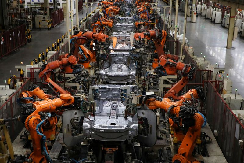 &copy; Reuters. Robots weld bodyshells of car are pictured on the assembly line in the Proton manufacturing plant in Tanjung Malim