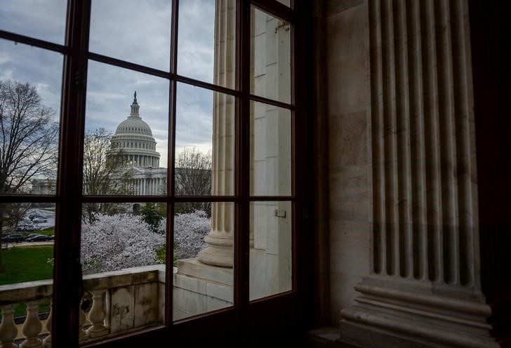 © Reuters. The U.S. Capitol is seen through a window in the Russell Senate office building in Washington