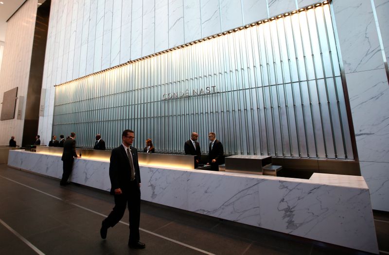 © Reuters. Conde Nast employees work in the lobby of the One World Trade Center tower in New York