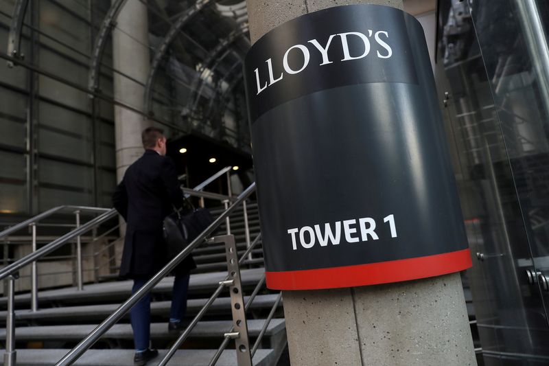 &copy; Reuters. FILE PHOTO: A worker enters the Lloyd&apos;s of London building in the City of London financial district