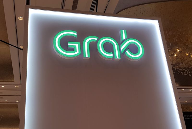 &copy; Reuters. A Grab logo is pictured at the Money 20/20 Asia Fintech Trade Show in Singapore