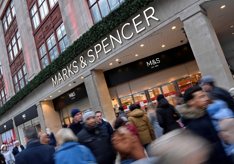 &copy; Reuters. FILE PHOTO: Shoppers walk past Marks and Spencer on Oxford Street in London