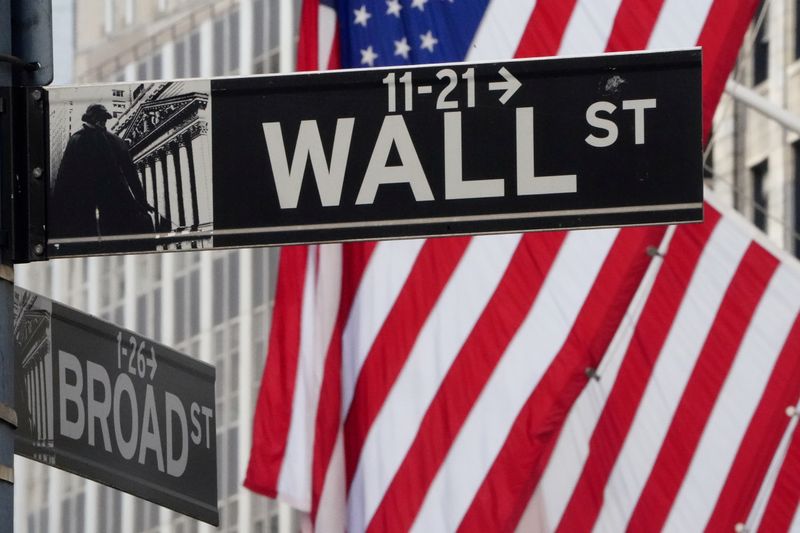 &copy; Reuters. FILE PHOTO: The Wall Street sign is pictured at the New York Stock exchange (NYSE) in the Manhattan borough of New York City