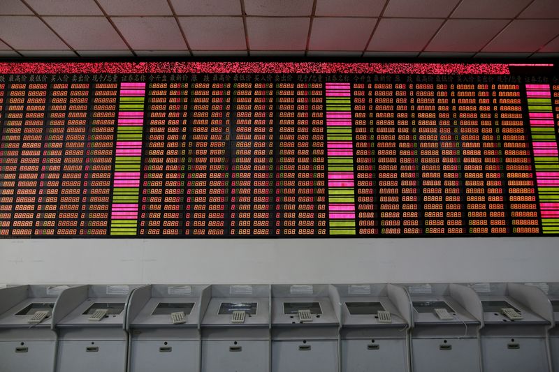 &copy; Reuters. An electronic stock information board displaying zero numbers on the latests stock prices before the opening of the first trading day after the week-long Lunar New Year holiday at a brokerage house in Shanghai