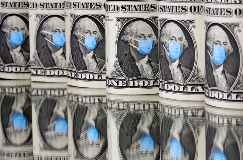 &copy; Reuters. FILE PHOTO: George Washington is seen with printed medical mask on the one Dollar banknotes in this illustration taken