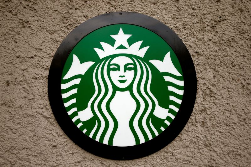 &copy; Reuters. FILE PHOTO:  Company&apos;s logo is seen at a Starbucks coffee shop in Zurich