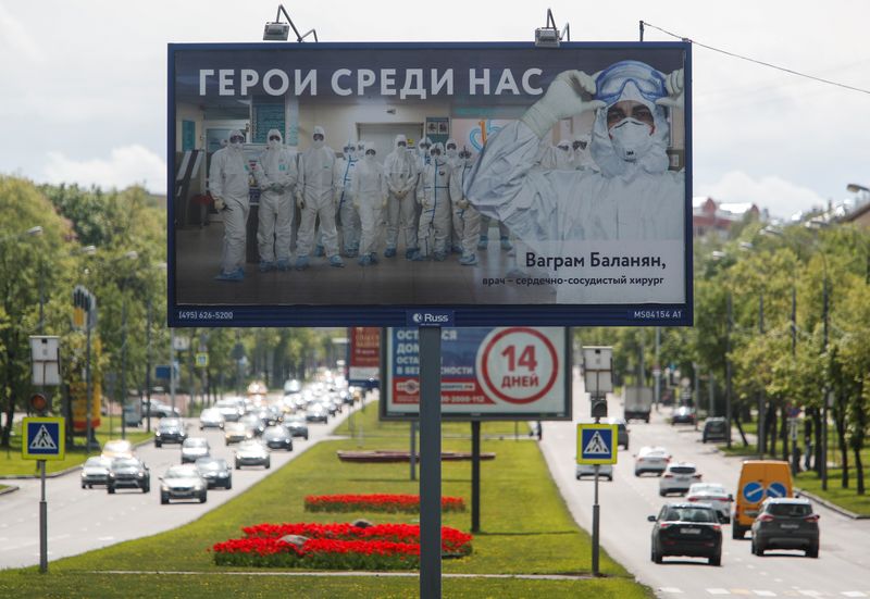 &copy; Reuters. FILE PHOTO: A billboard in support of medical specialists involved in the fight against the coronavirus disease is on display in Moscow