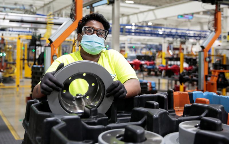 &copy; Reuters. A Dana Inc. assembly technician wears a face mask as she assembles axles for automakers, amid the coronavirus (COVID-19) outbreak, in Toledo