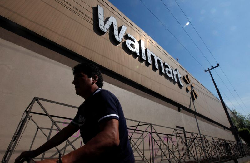 &copy; Reuters. A person walks outside a Wal-Mart store in Mexico City