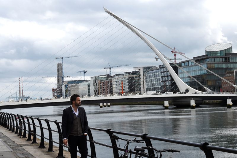 &copy; Reuters. A man walks past offices in the Irish Financial Services Centre in Dublin