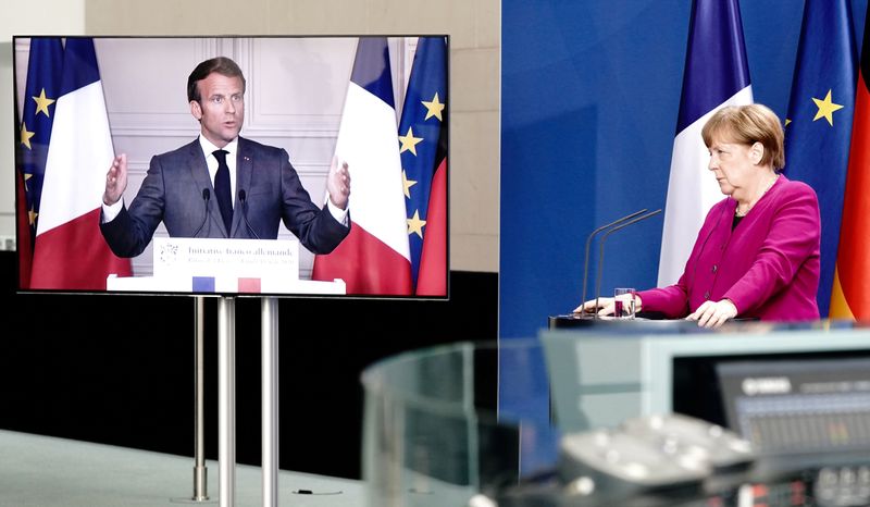 © Reuters. FILE PHOTO: German Chancellor Angela Merkel holds a joint video news conference with French President Emmanuel Macron