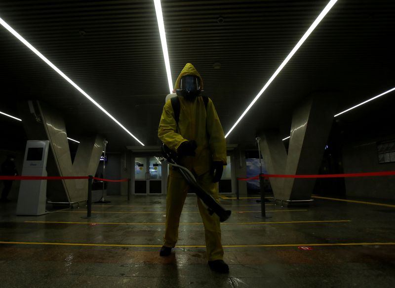 &copy; Reuters. Emergencies Ministry members sanitize a railway station amid the outbreak of the coronavirus disease in Moscow