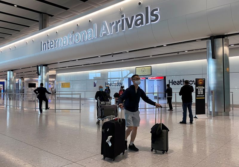 &copy; Reuters. Passengers arrive from international flights at Heathrow Airport in London