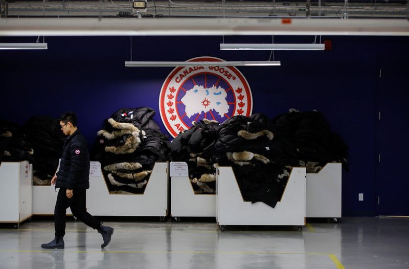 &copy; Reuters. A man walks by jackets at the Canada Goose factory in Toronto