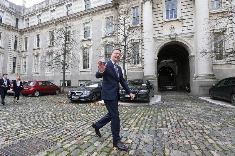 © Reuters. FILE PHOTO: Irish Finance Minister Paschal Donohoe walks outside Government Buildings in Dublin