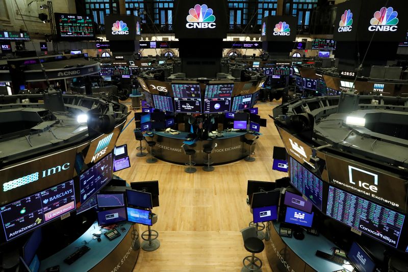 &copy; Reuters. FILE PHOTO: Floor traders work space is seen on the trading floor after the closing bell, following traders positive for Coronavirus disease (COVID-19), at the NYSE in New York