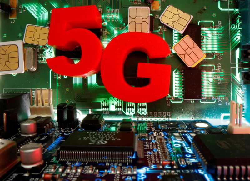 &copy; Reuters. FILE PHOTO:  SIM cards and 3d printed objects representing 5G are put on a motherboard in this picture illustration