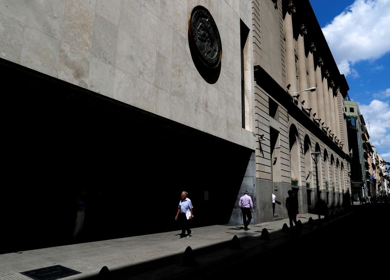 &copy; Reuters. Pedestrians walk past the facade of the Buenos Aires Stock Exchange, in Buenos Aires