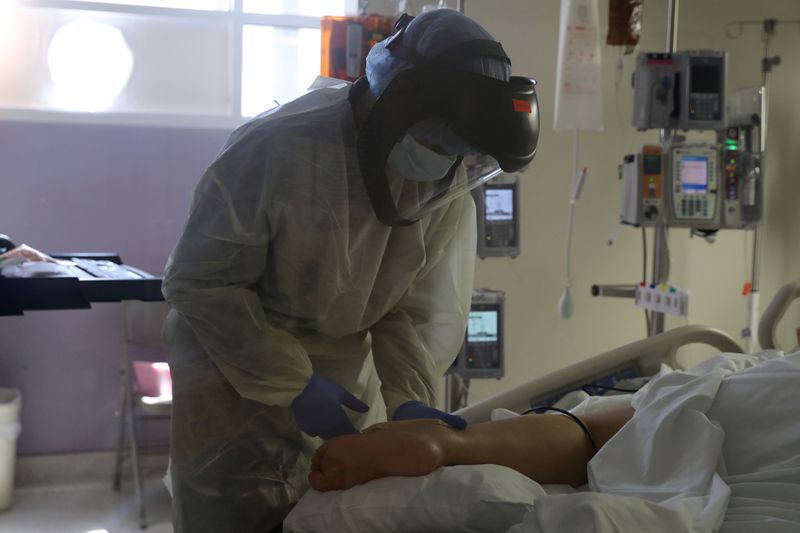 &copy; Reuters. A patient suffering from the coronavirus disease (COVID-19) is treated in the Intensive Care Unit (ICU), at Scripps Mercy Hospital in Chula Vista