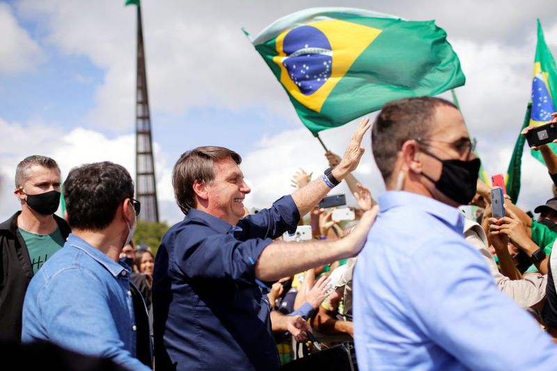 &copy; Reuters. Brazil&apos;s President Jair Bolsonaro greets supporters during a protest in his favor in front of the Planalto Palace, amid the coronavirus disease (COVID-19) outbreak, in Brasilia