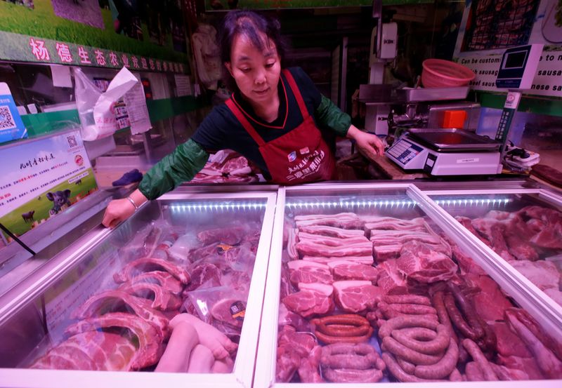&copy; Reuters. FILE PHOTO: Pork for sale is seen at Sanyuanli market  in Beijing