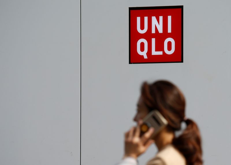 &copy; Reuters. FILE PHOTO: A woman walks past a Uniqlo store at Myeongdong shopping district in Seoul