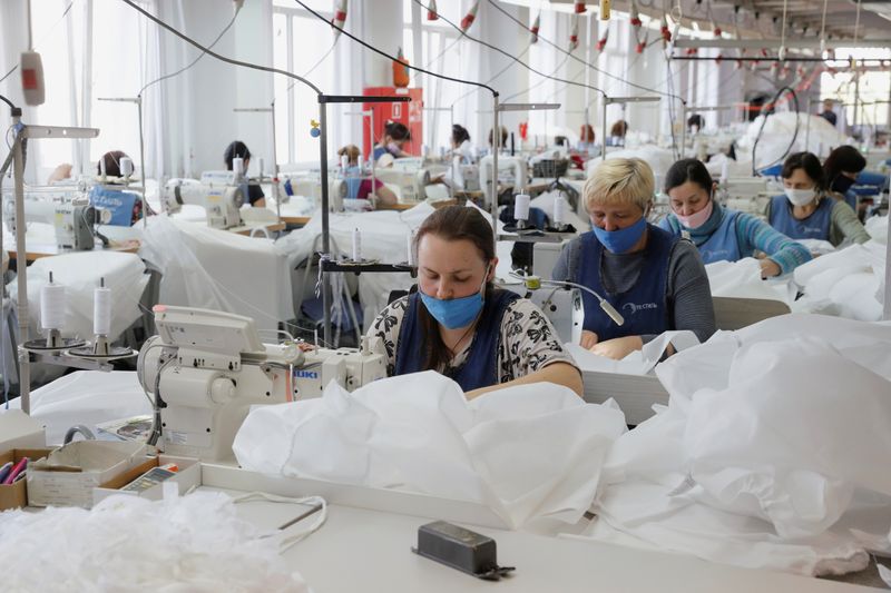 &copy; Reuters. Employees sew protective suits at the Textile-Contact company&apos;s factory in Chernihiv