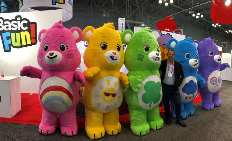 &copy; Reuters. FILE PHOTO:  Basic Fun CEO Jay Foreman and Care Bears costume characters stand in front of the companyÕs showroom