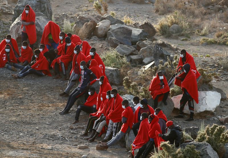 &copy; Reuters. Group of immigrants is pictured at Las Carpinteras beach on the island of Gran Canaria