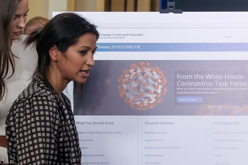 &copy; Reuters. Katie Miller, press secretary for U.S. Vice President Pence, helps prepare for the daily coronavirus task force briefing at the White House in Washington