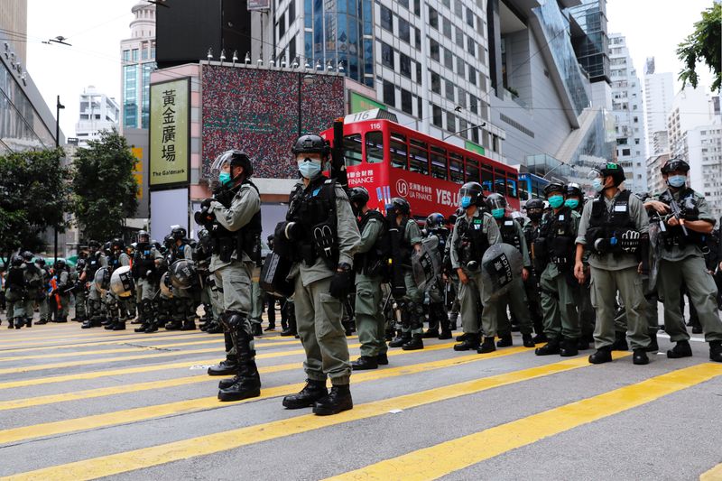 &copy; Reuters. Riot police stand guard during a march against Beijing&apos;s plans to impose national security legislation in Hong Kong