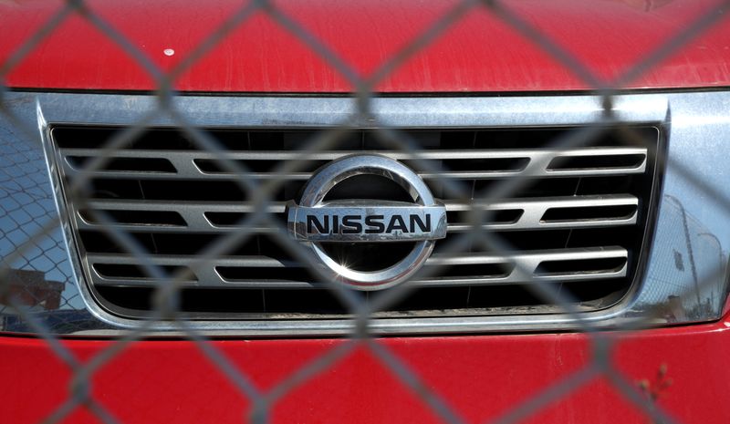 &copy; Reuters. The logo of Nissan is seen on a car through a fence at Nissan factory at Zona Franca during the coronavirus disease (COVID-19) outbreak in Barcelona