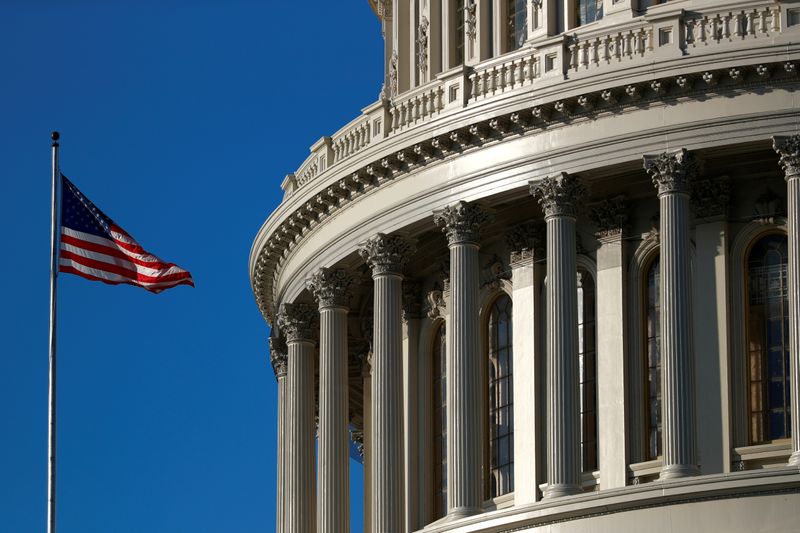 &copy; Reuters. FILE PHOTO: A U.S. flag flies outside of the Capitol dome ahead of the House of Representatives resolution appointing managers for Trump impeachment trial