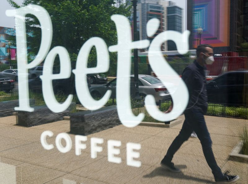 &copy; Reuters. A man passes a Peet&apos;s coffee shop in Washington, USA