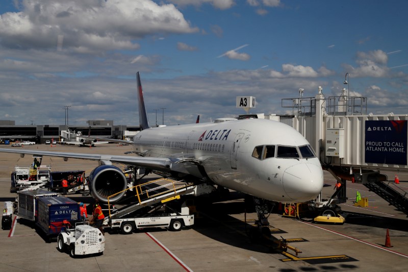 &copy; Reuters. FILE PHOTO: A Delta Airlines plane is parked at a gate as the novel coronavirus outbreak continues, in Atlanta, Georgia