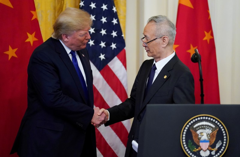 &copy; Reuters. FILE PHOTO: U.S. President Donald Trump shakes hands with Chinese Vice Premier Liu He during U.S.-China trade signing ceremony at the White House in Washington