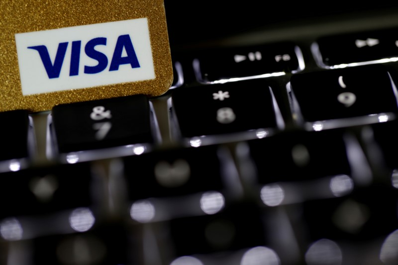 © Reuters. FILE PHOTO: A Visa credit card is seen on a computer keyboard in this picture illustration