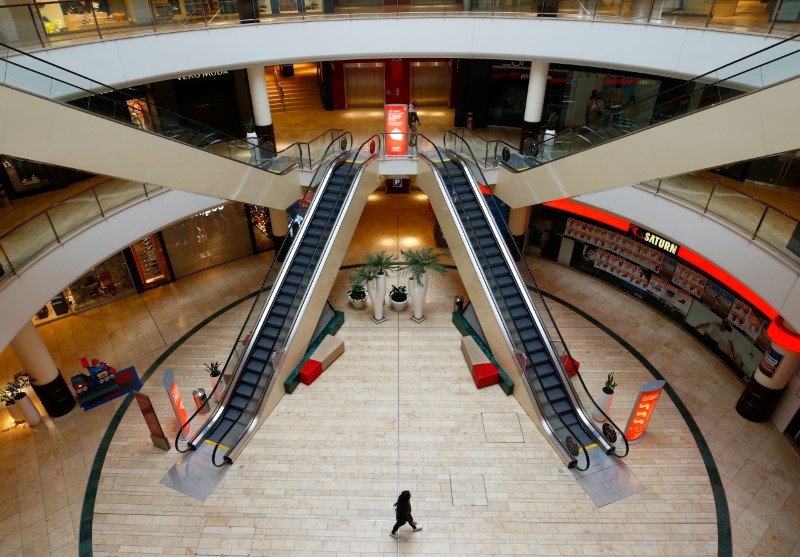 &copy; Reuters. FILE PHOTO: A person is seen inside an empty shopping mall during a partial lockdown in Leverkusen